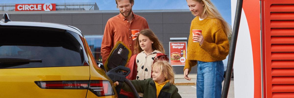 Family using EV charger